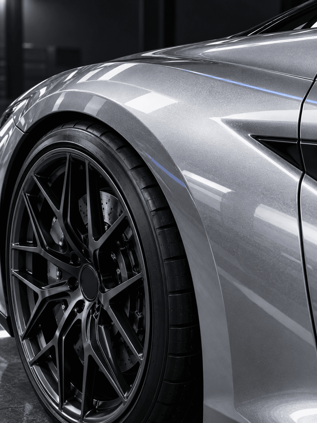 Clean wheel and panel detail under studio light.