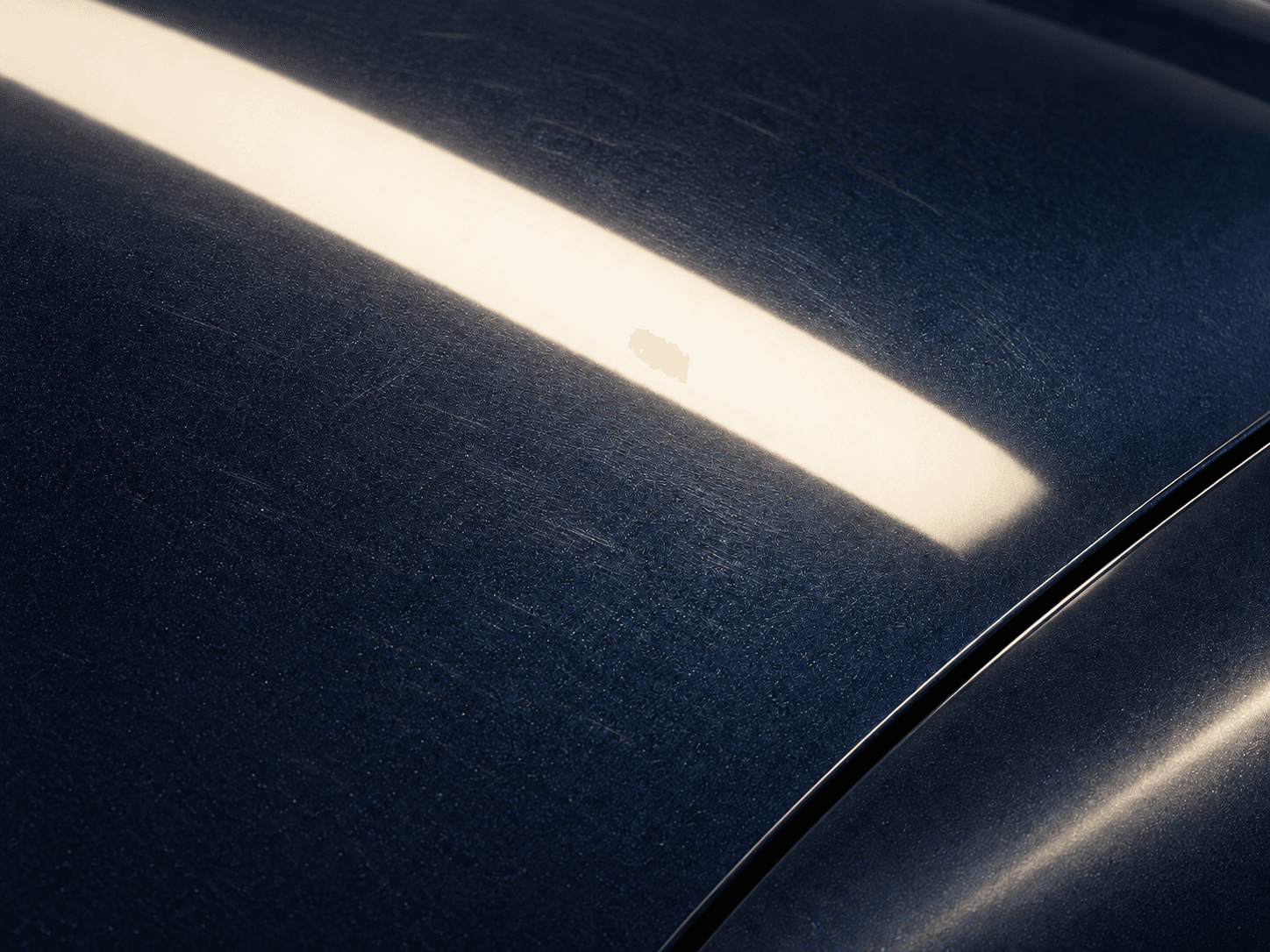 AI-generated illustrative before concept showing fine wash marks on a navy painted surface